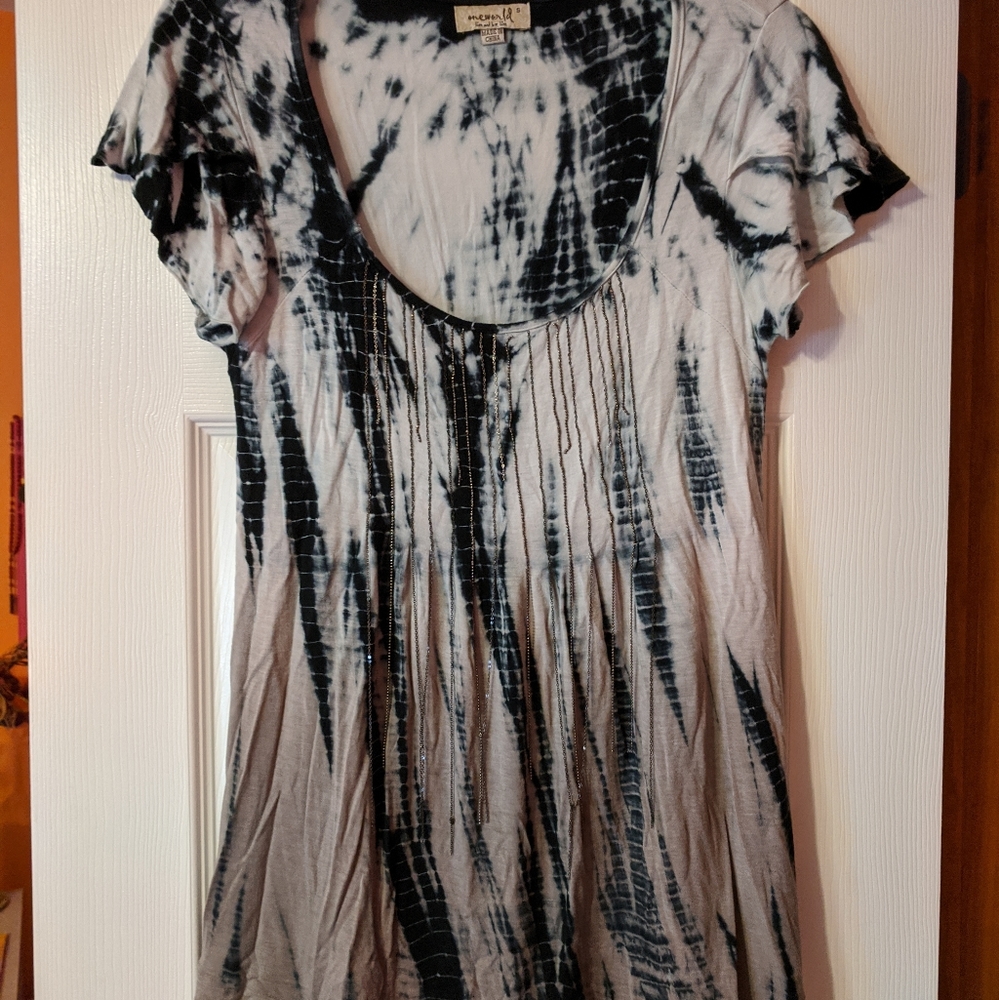 Oneworld top rayon and spandex. Very comfortable